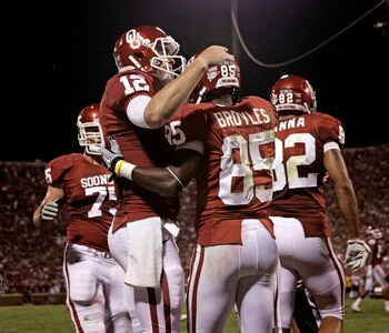 NORMAN, OK - SEPTEMBER 24:  Quarterback Landry Jones #12 congratulates wide receiver Ryan Broyles #85 of the Oklahoma Sooners after scoring a touchdown against the Missouri Tigers on September 24, 2011 at Gaylord Family-Oklahoma Memorial Stadium in Norman
