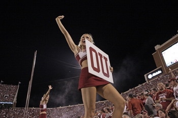 NORMAN, OK - SEPTEMBER 24:  An Oklahoma University cheerleader cheers during game against the Missouri Tigers on September 24, 2011 at Gaylord Family-Oklahoma Memorial Stadium in Norman, Oklahoma.  Oklahoma defeated Missouri 38-28.  (Photo by Brett Deerin