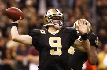 NEW ORLEANS - NOVEMBER 30: Quarterback Drew Brees #9 of the New Orleans Saintsthrows a 2-yard touchdown pass in the third quarter against the New England Patriots at Louisana Superdome on November 30, 2009 in New Orleans, Louisiana. (Photo by Scott Haller