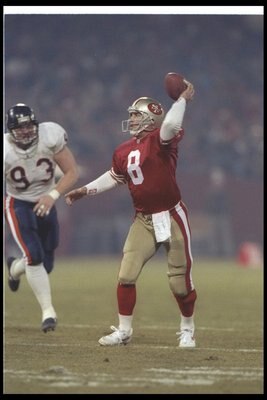 23 Dec 1991: Quarterback Steve Young of the San Francisco 49ers passes the ball during a game against the Chicago Bears at Candlestick Park in San Francisco, California. The 49ers won the game, 52-14.