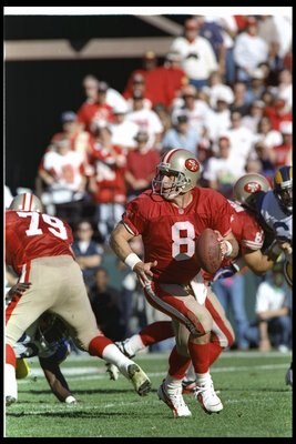 26 Nov 1995: Quarterback Steve Young of the San Francisco 49ers looks to pass the ball during a game against the St Louis Rams at 3Com Park in San Francisco, California. The 49ers won the game, 41-13.
