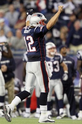 FOXBORO, MA - SEPTEMBER 18:   Tom Brady #12 of the New England Patriots celebrates the two point conversion in the fourth quarter against the San Diego Chargers on September 18, 2011 at Gillette Stadium in Foxboro, Massachusetts.  (Photo by Elsa/Getty Ima