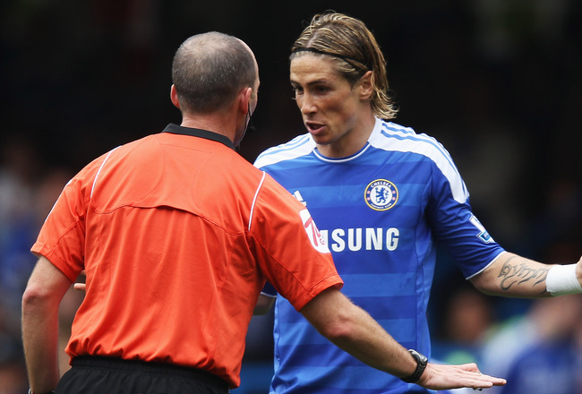 LONDON, ENGLAND - SEPTEMBER 24:  Fernando Torres of Chelsea talks to referee Mike Dean during the Barclays Premier League match between Chelsea and Swansea City at Stamford Bridge on September 24, 2011 in London, England.  (Photo by Clive Rose/Getty Image