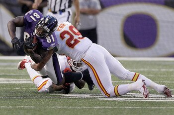 BALTIMORE, MD - AUGUST 19: Wide receiver Anquan Boldin #81 of the Baltimore Ravens is tackled by safety Eric Berry #29 of the Kansas City Chiefs  during the first half of a preseason game at M&T Bank Stadium on August 19, 2011 in Baltimore, Maryland.  (Ph
