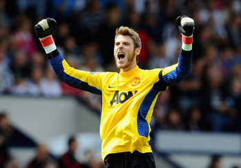 WEST BROMWICH, ENGLAND - AUGUST 14: David De Gea of Manchester United celebrates the goal scored by Wayne Rooney during the Barclays Premier League match between West Bromwich Albion and Manchester United at The Hawthorns on August 14, 2011 in West Bromwi