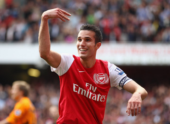 LONDON, ENGLAND - SEPTEMBER 24:  Robin Van Persie of Arsenal celebrates his second goal during the Barclays Premier League match between Arsenal and Bolton Wanderers at Emirates Stadium on September 24, 2011 in London, England.  (Photo by Clive Mason/Gett