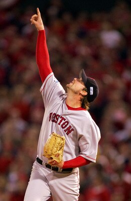 ST LOUIS - OCTOBER 27:  Pitcher Derek Lowe #32 of the Boston Red Sox points to a pop-up out hit by Albert Pujols #5 of the St. Louis Cardinals in the sixth inning during game four of the World Series on October 27, 2004 at Busch Stadium in St. Louis, Miss