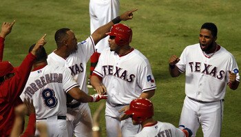 Adrian Beltre is surrounded by teammates following his game-tying sixth inning solo home run in last night's game 5 win