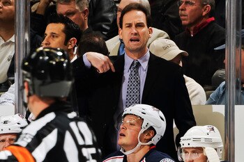 Scott Arniel asks the ref to help him out with Derek Dorsett.