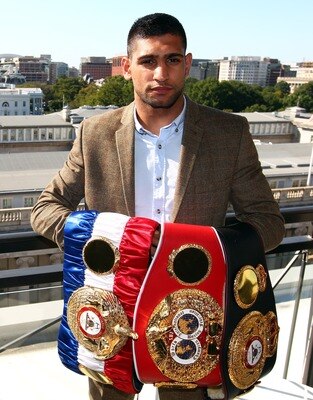 Amir Khan holding his world titles