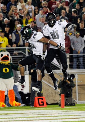 STANFORD, CA - NOVEMBER 12:  LaMichael James #21 and Rahsaan Vaughn #10 of the Oregon Ducks celebrates after James rushed fifty eight yards for a touchdown against the Stanford Cardinal at Stanford Stadium on November 12, 2011 in Stanford, California.  (P