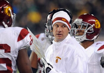 EUGENE, OR - NOVEMBER 19: Head coach Lane Kiffin of the USC Trojans speaks with his team in the first half of the game against the Oregon Ducks at Autzen Stadium on November 19, 2011 in Eugene, Oregon. (Photo by Steve Dykes/Getty Images)