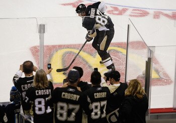 PITTSBURGH, PA - NOVEMBER 21:  Fans watch as Sidney Crosby #87 of the Pittsburgh Penguins takes the ice for warmups against the New York Islanders for the first time since sustaining a concussion on January 5 during the game on November 21, 2011 at CONSOL