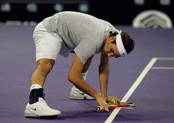 SHANGHAI, CHINA - NOVEMBER 11: Roger Federer of Switzerland stretches during practice in preparation for The Masters Cup at Qi Zhong Stadium November 11, 2005 in Shanghai, China. (Photo by Matthew Stockman/Getty Images)