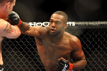 LAS VEGAS - JULY 11:  (R-L) Jon Jones connects with a right punch on Jake O'Brein during their light heavyweight bout during UFC 100 on July 11, 2009 in Las Vegas, Nevada. Jones defeated O'Brein by second round tapout.  (Photo by Jon Kopaloff/Getty Images