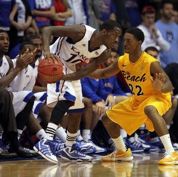 LAWRENCE, KS - DECEMBER 06:  Tyshawn Taylor #10 of the Kansas Jayhawks in action during the game against the Long Beach State 49ers on December 6, 2011 at Allen Fieldhouse in Lawrence, Kansas.  (Photo by Jamie Squire/Getty Images)