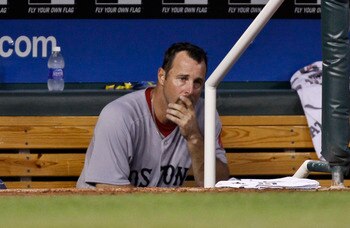 KANSAS CITY, MO - AUGUST 20:  Starting pitcher Tim Wakefield #49 of the Boston Red Sox watches  from the dugout in the sixth inning of game with the Kansas City Royals  at Kauffman Stadium on August 20, 2011 in Kansas City, Missouri. (Photo by Ed Zurga/Ge