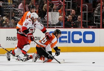 Giroux doesn't care that Eric Staal has five inches on him. That is G's puck.