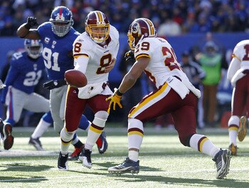 EAST RUTHERFORD, NJ - DECEMBER 18:  Rex Grossman #8 hands off to Roy Helu #29 of the Washington Redskins during a game against the New York Giants at MetLife Stadium on December 18, 2011 in East Rutherford, New Jersey.  (Photo by Jeff Zelevansky/Getty Ima