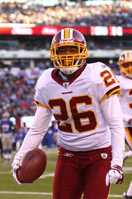 EAST RUTHERFORD, NJ - DECEMBER 18:  Josh Wilson #26 of the Washington Redskins celebrates his interception during their game against the New York Giants at MetLife Stadium on December 18, 2011 in East Rutherford, New Jersey.  (Photo by Al Bello/Getty Imag