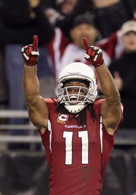GLENDALE, AZ - DECEMBER 18:  Wide receiver Larry Fitzgerald #11 of the Arizona Cardinals celebrates after a 32 yard reception against the Cleveland Browns during overtime of the NFL game at the University of Phoenix Stadium on December 18, 2011 in Glendal