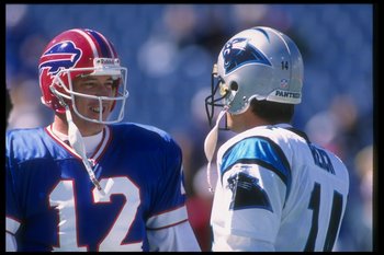 Jim Kelly and Frank Reich talk shop before a 1995 game between the Bills and Panthers.