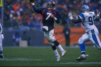 John Elway (7) rolls to his right and throws a "waggle" pass against the Panthers.