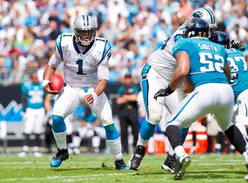 Cam Newton (1) can run, pass or hand off the football out of the Muddle Huddle formation.