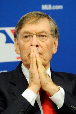 Is Bud Selig praying for a salary cap in baseball?