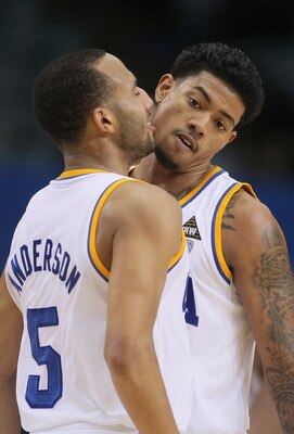 LOS ANGELES, CA - DECEMBER 20:  Jerime Anderson (L) #5 of the UCLA Bruins congratulates Tyler Lamb #1 after making a basket in the second half against the the UC Irvine Anteaters at LA Sports Arena on December 20, 2011 in Los Angeles, California. UCLA def