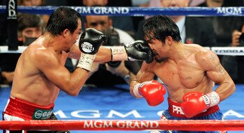 Juan Manuel Marquez jabbing the face of Manny Pacquiao