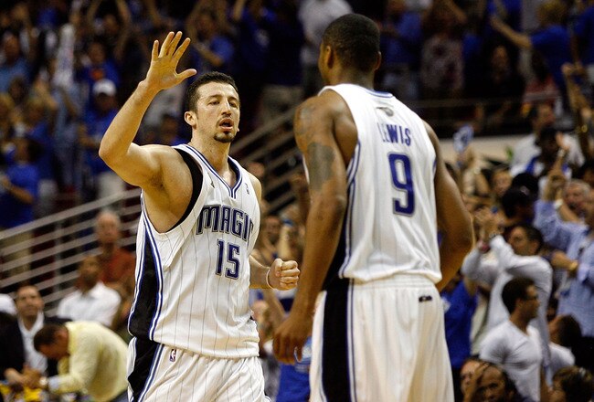 ORLANDO, FL - JUNE 09:  Hedo Turkoglu #15 of the Orlando Magic gives teammate Rashard Lewis #9 a high five in the fourth quarter of Game Three of the 2009 NBA Finals against the Los Angeles Lakers on June 9, 2009 at Amway Arena in Orlando, Florida.  NOTE 