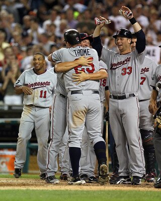 Jim Thome is congratulated by teammates after hitting his 600th home run.