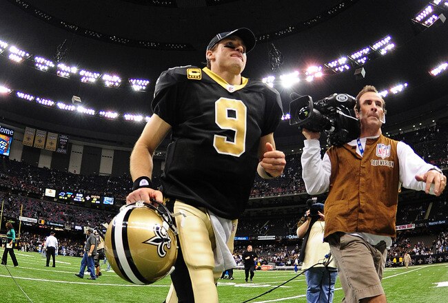 NEW ORLEANS, LA - JANUARY 1: Drew Brees #9 of the New Orleans Saints heads off the field after the game against the Carolina Panthers at the Mercedes-Benz Superdome on January 1, 2012 in New Orleans, Louisiana  (Photo by Scott Cunningham/Getty Images)