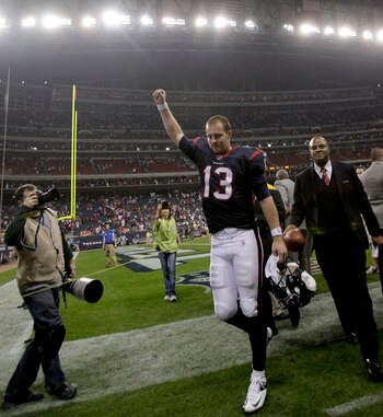 T.J Yates raises his fist in triumph after he guided the Texans to their first playoff win in team history.