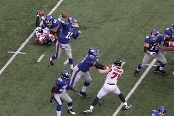 Eli Manning steps into a pass during the Giants' 24-2 win over the Falcons.