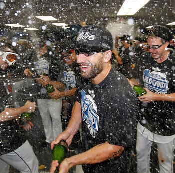 Canzler celebrates after the Rays' clinch the Wild Card. He played three games in a Rays uniform last season, going 1-3 as a PH/DH.