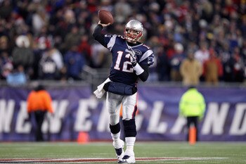 Tom Brady throws a pass in his record-setting performance, during a 45-10 win over Denver.