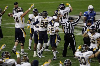WASHINGTON, DC - DECEMBER 28: Cheatham Norrils #36 of the Toledo Rockets celebrates with teammates after the Rockets recovered a fumble against the Air Force Falcons during the first half of the Military Bowl at RFK Stadium on December 28, 2011 in Washing
