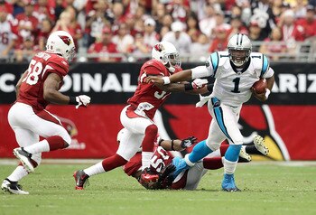 Cam Newton (1) threw for a record 422-yards in his NFL debut.