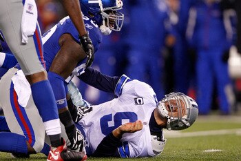 Jason Pierre-Paul knocks down Tony Romo in New York's 37-34 win.