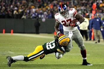 Brandon Jacobs (27) is a big, bruising back who runs to the outside more often than he should.