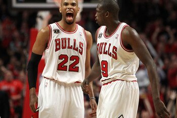 CHICAGO, IL - MAY 15:  (L-R) Taj Gibson #22 and Luol Deng #9 of the Chicago Bulls celebrate a play against the Miami Heat in Game One of the Eastern Conference Finals during the 2011 NBA Playoffs on May 15, 2011 at the United Center in Chicago, Illinois. 