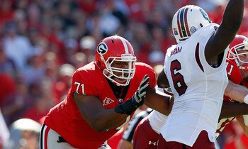 ATHENS, GA - SEPTEMBER 10:  Aaron Murray #11 of the Georgia Bulldogs is hit by Melvin Ingram #6 and another defender of the South Carolina Gamecocks at Sanford Stadium on September 10, 2011 in Athens, Georgia.  (Photo by Kevin C. Cox/Getty Images)