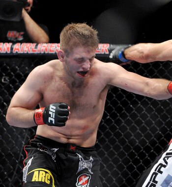 DALLAS - SEPTEMBER 19:  UFC fighter Nik Lentz (L) battles UFC fighter Rafaello Oliveira during their Lightweight bout at UFC 103: Franklin vs. Belfort at the American Airlines Center on September 19, 2009 in Dallas, Texas.  (Photo by Jon Kopaloff/Getty Im