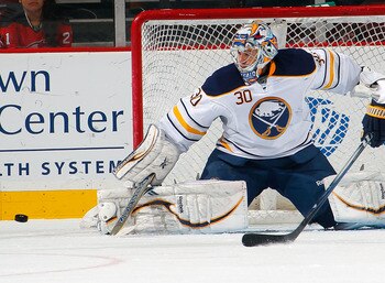 NEWARK, NJ - JANUARY 24:  Goalie Ryan Miller #30 of the Buffalo Sabres makes a save during an NHL hockey game against the New Jersey Devils at Prudential Center on January 24, 2012 in Newark, New Jersey.  (Photo by Paul Bereswill/Getty Images)