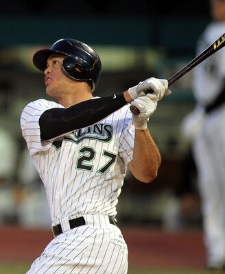 Standing at 6'-5" 240 lbs, Stanton is a monster on the baseball field.  He crushes white leather balls with red stitching and is a real 50 HR threat.