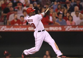 ANAHEIM, CA - SEPTEMBER 24:  Torii Hunter #48 of the Los Angeles Angels of Anaheim hits a two run home run in the sixth inning against the Oakland Athletics in the first inning on September 24, 2011 at Angel Stadium in Anaheim, California.  (Photo by Step