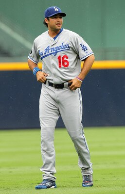 ATLANTA - SEPTEMBER 4: Andre Either #16 of the Los Angeles Dodgers walks in the rain before a game against the Atlanta Braves on September 4, 2011 at Turner Field in Atlanta, Georgia. The Braves beat the Dodgers 4-3. (Photo by Joe Murphy/Getty Images)