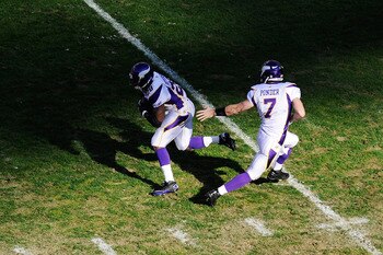 LANDOVER, MD - DECEMBER 24:   Christian Ponder #7 of the Minnesota Vikings hands the ball off to Adrian Peterson #28 of the Minnesota Vikings during a game against the Washington Redskins at FedExField on December 24, 2011 in Landover, Maryland.  (Photo b